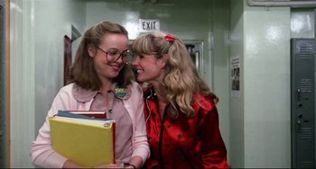 Movie still from “Rock 'n' Roll High School” (1979), directed by Joe Dante – Two young women are smiling while holding books; Close Up shot, Low angle