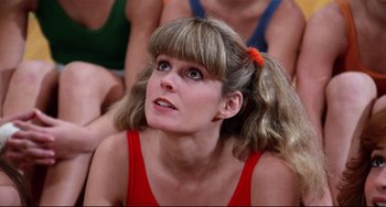 Movie still from “Rock 'n' Roll High School” (1979), directed by Joe Dante – A woman in a red shirt looking up at something; Close Up shot, Low angle