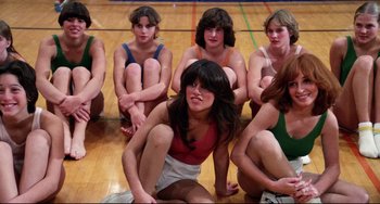 Movie still from “Rock 'n' Roll High School” (1979), directed by Joe Dante – A group of young women sitting on the floor; Medium shot, Low angle