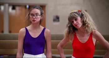 Movie still from “Rock 'n' Roll High School” (1979), directed by Joe Dante – Two young women standing next to each other; Medium shot, Low angle