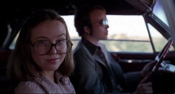 Movie still from “Rock 'n' Roll High School” (1979), directed by Joe Dante – A woman and a man sitting in the back of a car; Close Up shot, Low angle