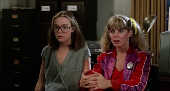Movie still from “Rock 'n' Roll High School” (1979), directed by Joe Dante – Two young women sitting next to each other in a room; Close Up shot, Low angle