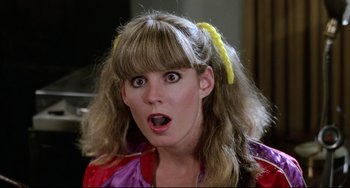 Movie still from “Rock 'n' Roll High School” (1979), directed by Joe Dante – A person with a surprised look on their face; Close Up shot, Low angle