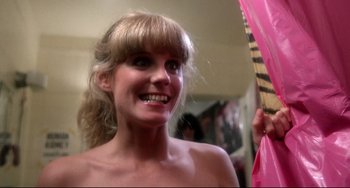 Movie still from “Rock 'n' Roll High School” (1979), directed by Joe Dante – A woman with blonde hair is smiling at the camera; Close Up shot, Low angle