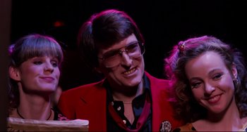 Movie still from “Rock 'n' Roll High School” (1979), directed by Joe Dante – A man in a red jacket and glasses; Close Up shot, Low angle