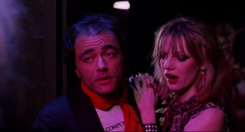 Movie still from “Rock 'n' Roll High School” (1979), directed by Joe Dante – A man and a woman are standing next to each other; Close Up shot, Low angle