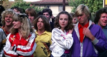 Movie still from “Rock 'n' Roll High School” (1979), directed by Joe Dante – A group of people standing next to each other; Medium shot, Low angle