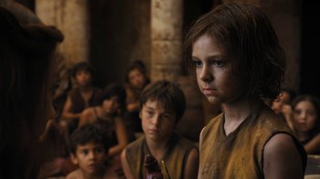 Movie still from “Game of Thrones” (2011), created by D.B. Weiss – A group of young people sitting in a room; Close Up shot, Low angle