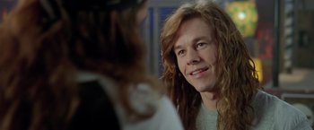 Movie still from “Rock Star” (2001), directed by Stephen Herek – A person with long brown hair; Close Up shot, Over the shoulder angle