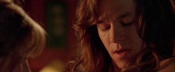 Movie still from “Rock Star” (2001), directed by Stephen Herek – A woman's face with her hair blowing in the wind; Close Up shot, Over the shoulder angle