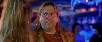 Movie still from “Rock Star” (2001), directed by Stephen Herek – A person with long hair; Close Up shot, Over the shoulder angle