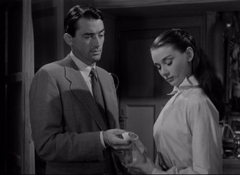 Movie still from “Roman Holiday” (1953), directed by William Wyler – A man and a woman looking at each other in a room; Close Up shot, Over the shoulder angle