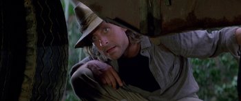 Movie still from “Romancing the Stone” (1984), directed by Robert Zemeckis – A person wearing a hat; Close Up shot, Low angle