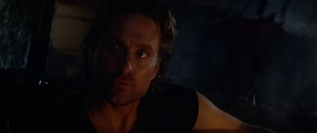 Movie still from “Romancing the Stone” (1984), directed by Robert Zemeckis – A person with long brown hair; Close Up shot, Over the shoulder angle