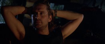 Movie still from “Romancing the Stone” (1984), directed by Robert Zemeckis – A person with long hair; Close Up shot, Low angle