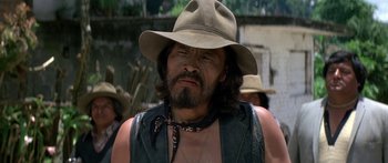 Movie still from “Romancing the Stone” (1984), directed by Robert Zemeckis – A person wearing a hat; Close Up shot, Low angle