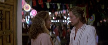 Movie still from “Romancing the Stone” (1984), directed by Robert Zemeckis – A man and a woman talking to each other; Close Up shot, Over the shoulder angle
