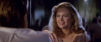 Movie still from “Romancing the Stone” (1984), directed by Robert Zemeckis – A beautiful woman sitting in front of a mirror; Close Up shot, Over the shoulder angle