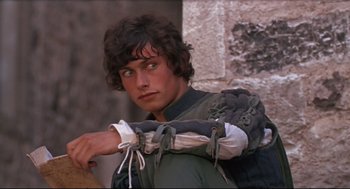 Movie still from “Romeo and Juliet” (1968), directed by Franco Zeffirelli – A young man wearing a medieval outfit; Close Up shot, High angle