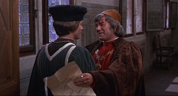 Movie still from “Romeo and Juliet” (1968), directed by Franco Zeffirelli – Two men in medieval garb talking to each other; Medium shot, Over the shoulder angle