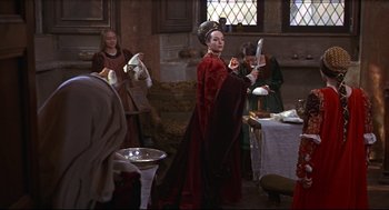 Movie still from “Romeo and Juliet” (1968), directed by Franco Zeffirelli – A group of people dressed in medieval clothing; Wide shot, Over the shoulder angle