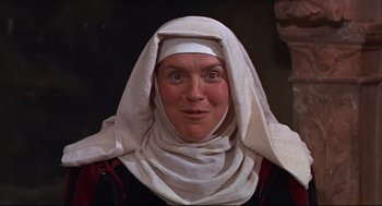 Movie still from “Romeo and Juliet” (1968), directed by Franco Zeffirelli – A woman wearing a head covering and a white head scarf; Close Up shot, Low angle