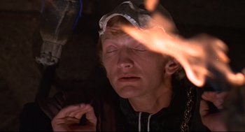 Movie still from “Romeo and Juliet” (1968), directed by Franco Zeffirelli – A man with a hat on is looking at the camera; Close Up shot, Low angle