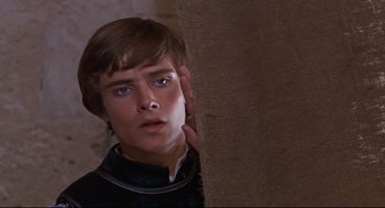 Movie still from “Romeo and Juliet” (1968), directed by Franco Zeffirelli – A young man is looking over a wall; Close Up shot, High angle