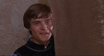Movie still from “Romeo and Juliet” (1968), directed by Franco Zeffirelli – A young man is looking over a wall; Close Up shot, High angle