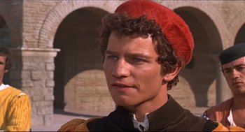 Movie still from “Romeo and Juliet” (1968), directed by Franco Zeffirelli – A person wearing a red hat; Close Up shot, High angle