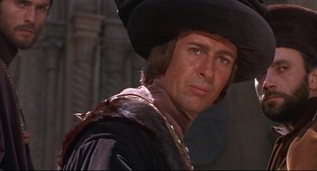 Movie still from “Romeo and Juliet” (1968), directed by Franco Zeffirelli – A person wearing a hat; Close Up shot, Over the shoulder angle