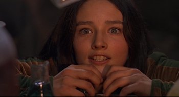 Movie still from “Romeo and Juliet” (1968), directed by Franco Zeffirelli – A woman with her hands on her chin; Close Up shot, Low angle