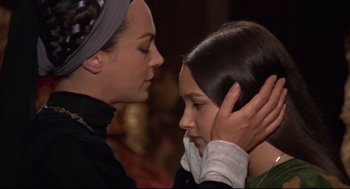 Movie still from “Romeo and Juliet” (1968), directed by Franco Zeffirelli – A woman and a girl are touching each other's hair; Close Up shot, Over the shoulder angle