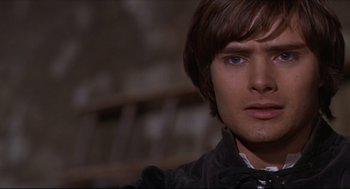 Movie still from “Romeo and Juliet” (1968), directed by Franco Zeffirelli – A man's face in a dark room; Close Up shot, Over the shoulder angle