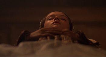 Movie still from “Romeo and Juliet” (1968), directed by Franco Zeffirelli – A young girl with her eyes closed and hands on her chest; Close Up shot, Low angle