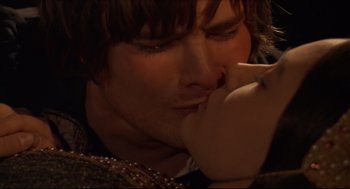 Movie still from “Romeo and Juliet” (1968), directed by Franco Zeffirelli – A person holding their hand to his face; Extreme Close Up shot, High angle