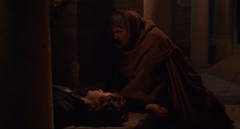 Movie still from “Romeo and Juliet” (1968), directed by Franco Zeffirelli – An old man and a young boy laying on the ground; Medium shot, High angle