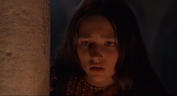 Movie still from “Romeo and Juliet” (1968), directed by Franco Zeffirelli – A young girl with long dark brown hair looking at the camera; Close Up shot, High angle