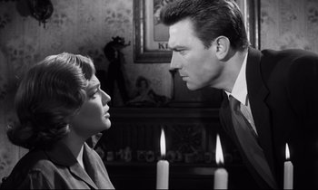 Movie still from “Room at the Top” (1958), directed by Jack Clayton – A man and a woman face to face in a black and white photo; Close Up shot, Low angle