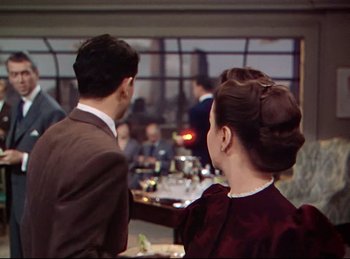 Movie still from “Rope” (1948), directed by Alfred Hitchcock – A man and a woman standing in front of each other; Medium shot, Over the shoulder angle