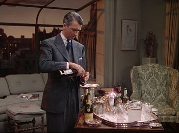 Movie still from “Rope” (1948), directed by Alfred Hitchcock – A man in a suit and tie pouring wine into a wine glass; Medium shot, High angle