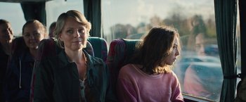 Movie still from “Rose” (2022), directed by Niels Arden Oplev – A woman and a girl are sitting on a bus; Close Up shot, Over the shoulder angle