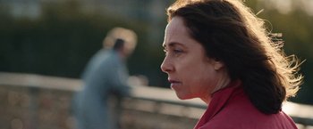 Movie still from “Rose” (2022), directed by Niels Arden Oplev – A person looking to the side; Close Up shot, Over the shoulder angle