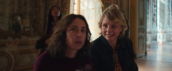 Movie still from “Rose” (2022), directed by Niels Arden Oplev – Two women are standing next to each other in a room; Close Up shot, Over the shoulder angle