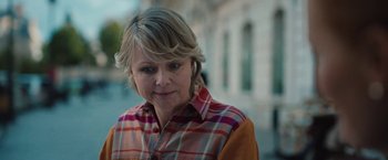 Movie still from “Rose” (2022), directed by Niels Arden Oplev – A person wearing a plaid shirt; Close Up shot, Over the shoulder angle