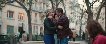 Movie still from “Rose” (2022), directed by Niels Arden Oplev – A man and a woman hugging on the sidewalk; Medium shot, Over the shoulder angle