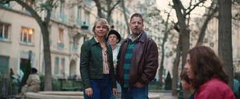 Movie still from “Rose” (2022), directed by Niels Arden Oplev – A man and a woman standing next to a man; Medium shot, Low angle