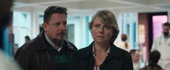 Movie still from “Rose” (2022), directed by Niels Arden Oplev – A man and a woman standing next to each other; Close Up shot, Over the shoulder angle