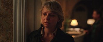 Movie still from “Rose” (2022), directed by Niels Arden Oplev – A person wearing a jacket; Close Up shot, Over the shoulder angle