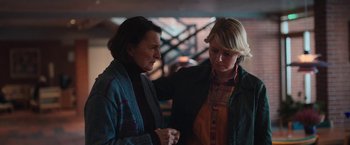 Movie still from “Rose” (2022), directed by Niels Arden Oplev – Two women standing next to each other in a room; Medium shot, Over the shoulder angle